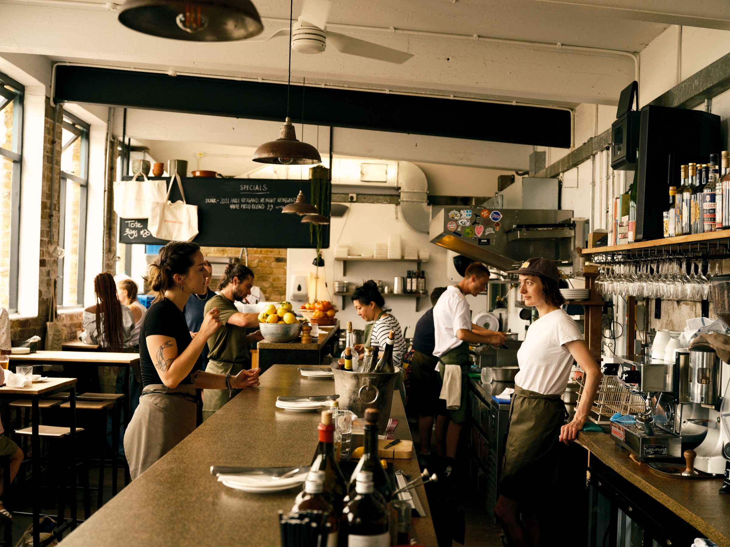 A team at work behind a busy bar