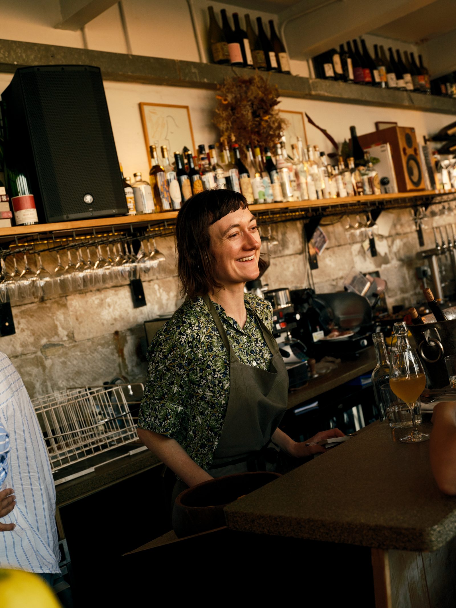 A bartender smiling at a guest